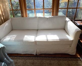 Two Cushion Slipped Covered Sofa...we have a pair of these.