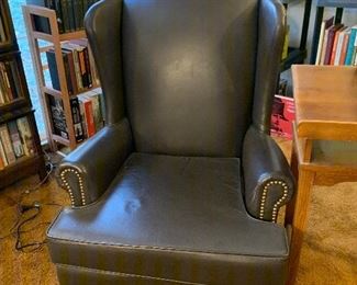 Leathe wingback chair with nail head trim...comfy!