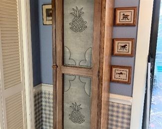 Antique cabinet with punched tin panels