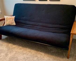 Black cushioned futon