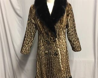 A. 1970S - OCELOT TRIMMED IN BLACK MINK - $1,850.00 .