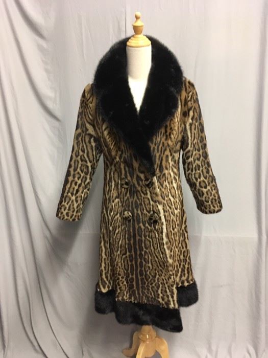 A. 1970S - OCELOT TRIMMED IN BLACK MINK - $1,850.00 .