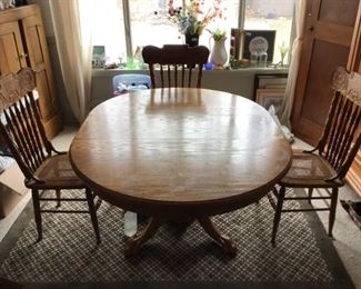 Claw Foot Oak Dining Table with Pressed Back Caned Chairs