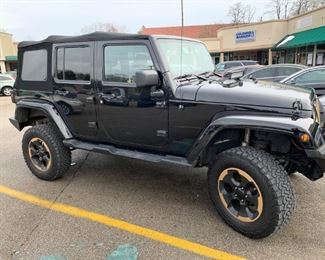 2014 Jeep Wrangler; 4 Door Sahara Ltd. Edition. 51k Miles, Lift Kit, Undercarriage Protection, Steel Bumpers, Winch, Dual Exhaust, Cold Air Intake, Summer Bar Doors, American Flag Sun Screen.  Includes Wall Door Mounting Hardware, Upgraded Alpine Speakers & Much More.  Pre-Sale Offered