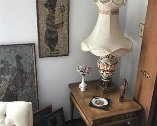 One of three solid wood tables with drawer. Also has a matching round one and a inlaid marble top coffee table! Graced by some local wall décor and a Capodimonte lamp which is also one of three!