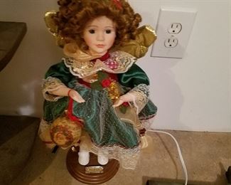 One of two animated lighted Christmas dolls