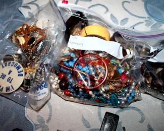 Bag lots of costume jewlery, political buttons, watches, etc.