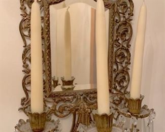 Mirrored candle sconce.