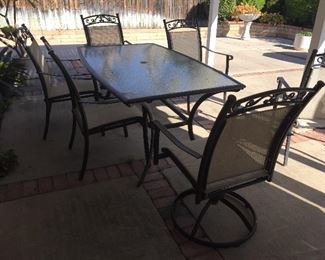 Patio furniture, bbq, plants, pots and yard art.