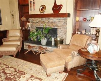 Charles Ray upholstered chairs with ottomans, in leather and neutral upholstery