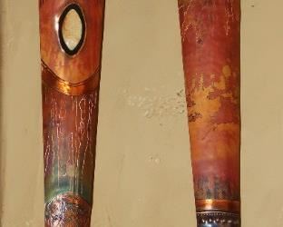 Tall copper figures from Hawaii