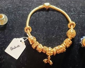 Pandora 14k bracelet with multiple charms