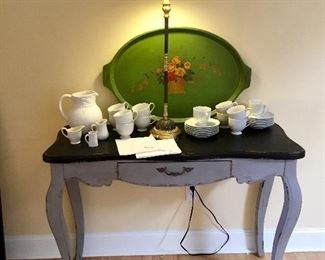 Shabby chic console table, vintage white dishes, lamp, vintage painted tray