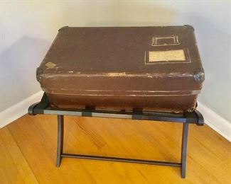 Vintage suitcase and luggage stand