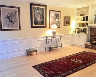 Living room with art & vintage metal glass top table & nice runner