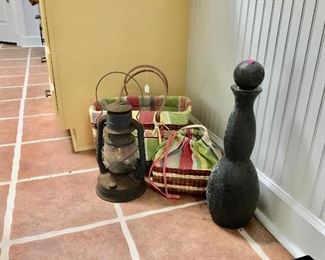 Picnic baskets, vintage bottle with cork, railroad lantern 