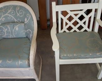 White wicker chair and white arm chair.
