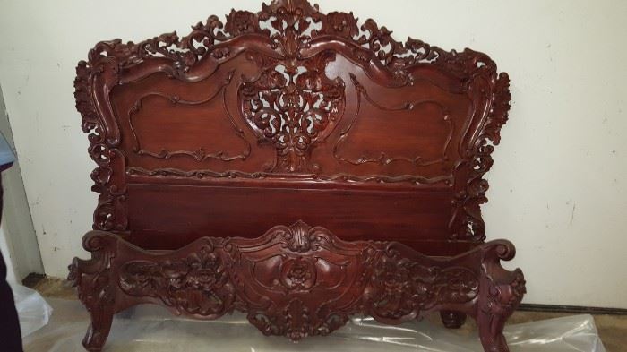 Very ornate hand carved mahogany queen bed. 