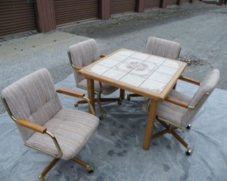 tile inlaid game table and four chairs.