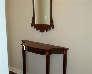 Hepplewhite inlaid hall table and Chippendale style mirror.