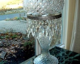 One of a pair very ornate crystal table lamps with prisms.