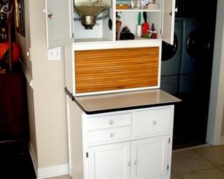 Hoosier cabinet shown with open top.