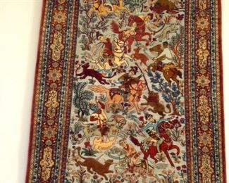 Hand knotted silk Persian rug.