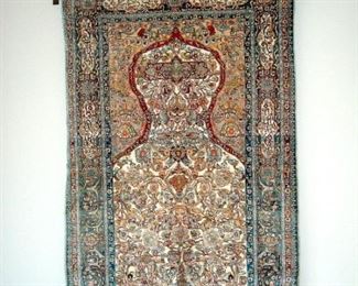 Hand knotted silk Persian prayer rug.