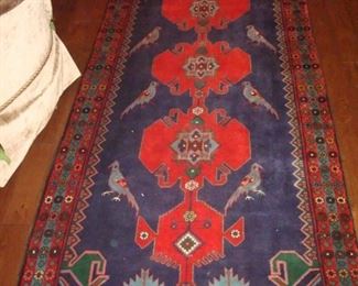 Hand knotted wool oriental runner. Approx. 4 ft by 12 ft.