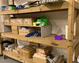 wooden rolling shelving unit and lots of shipping supplies