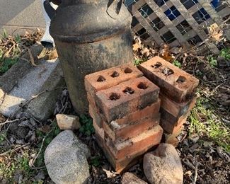 Milk can, bricks, rocks