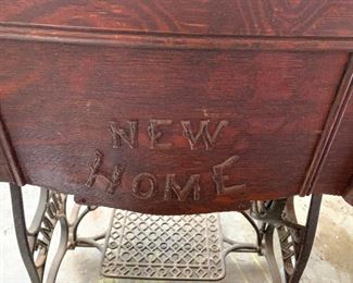 Vintage New Home sewing machine in cabinet