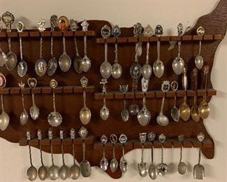 Collectible spoons. Note the holder shaped as the United States