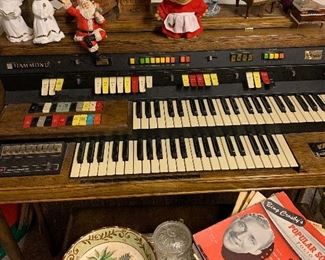 Organ, troll doll, sheet music and other music boxes. 
