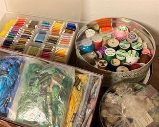 A large amount of embroidery thread and sewing supplies