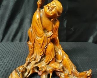 Carved wooden Buddha with kids
