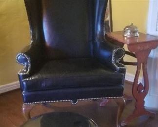 Classic vintage black leather wing back chair