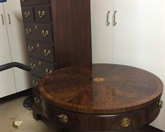 Round table and Henkel Harris Jewelry Cabinet.