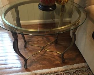Decorative brass table with glass top.