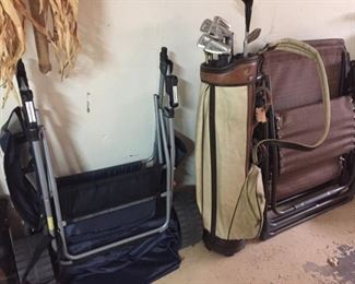 Folding chairs and vintage golf clubs.