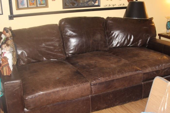 Very deep (front to back) extra long leather couch.