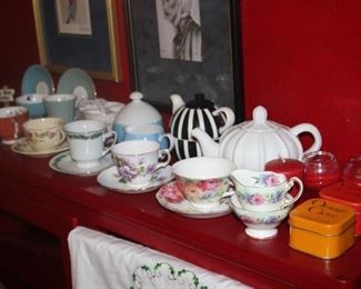 Tea cups, creamers, sugar bowls and tea pots.