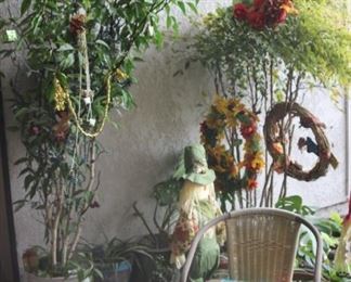 Decorated tree, pots and chairs.