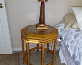 octagonal wood side table with glass top. Bedside lamp with palm tree base