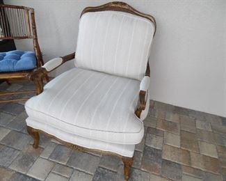 Upholstered chair, has some damage on right leg