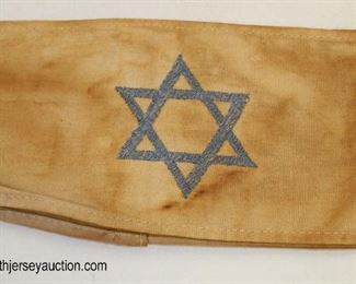 Lot 42: Holocaust style arm band with 6 sided star