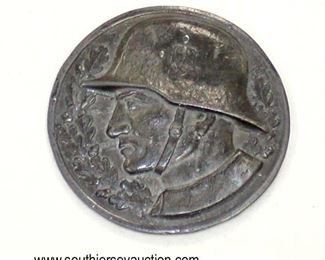 Lot 60: WWII table weight of German soldier with a helmet