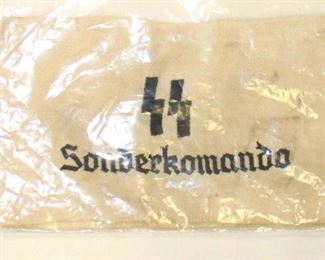 Lot 81: Embroidered in service to SS Sonderkomando arm band