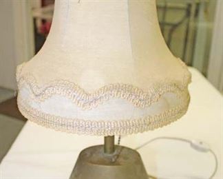 Lot 132: Hitler Yacht Grille Brass Felt Bottom Lamp, Slip Shade, Newer Cord approximately 12” high 6” wide (believed to have been on one of Hitler's boats with news articles)