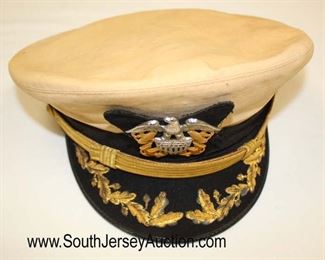 Lot 149: Lot of Personal Effects of Veteran of WWII, Korea, and Vietnam John D. McIntosh including WWII USN Officers Visor Cap, Photo of John D. McIntosh, 2 Military Photos, Front Band, and 2 Extra Hat Covers in the Original Shipping Box